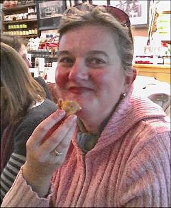 Patricia eating an empanada