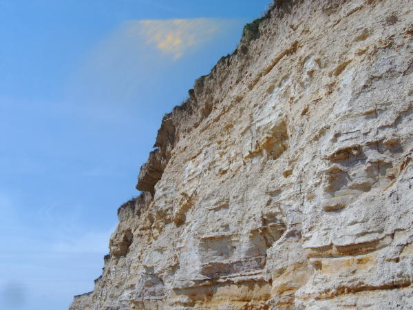 passing under the cliffs