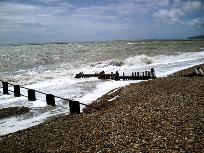 waves crashing onto the breakwater