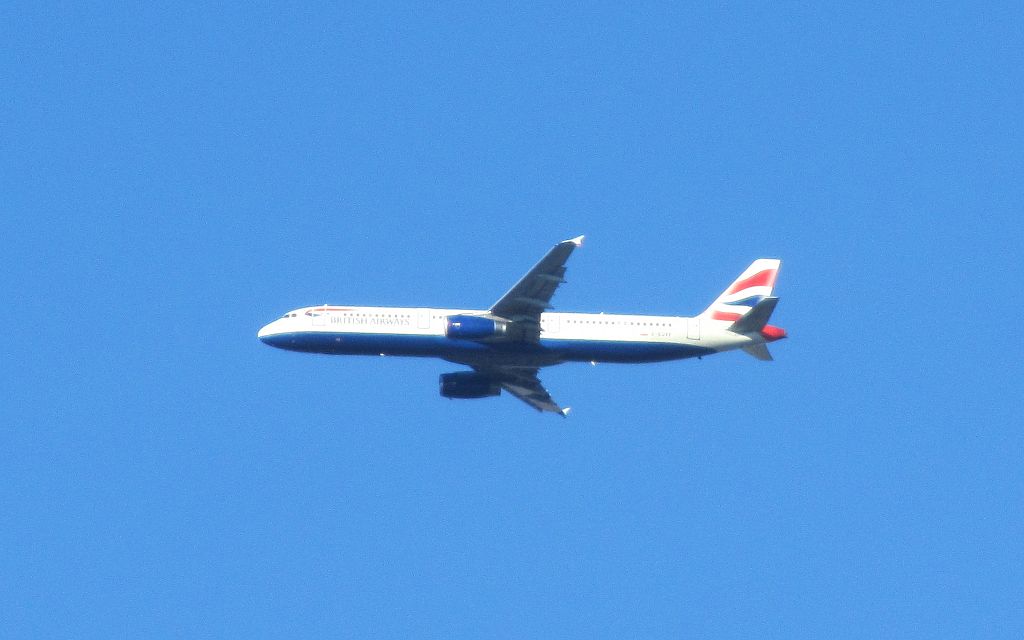 a plane in a beautiful blue sky