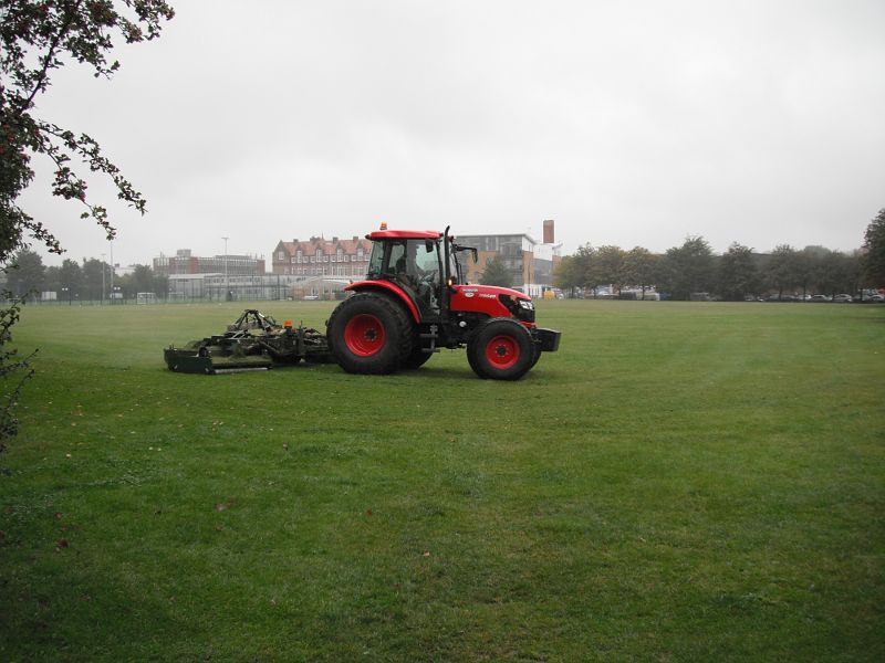 mowing the grass in the rain