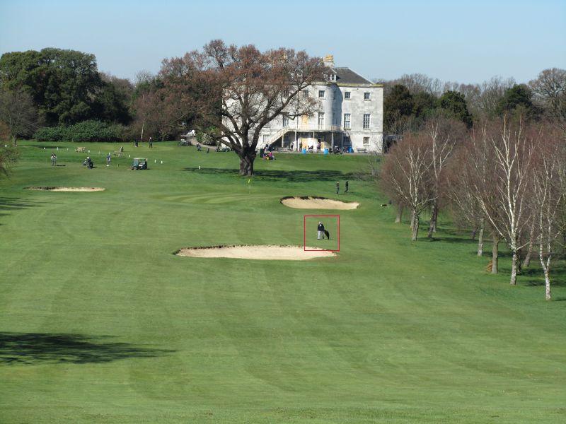 across a fairway towards the manor house