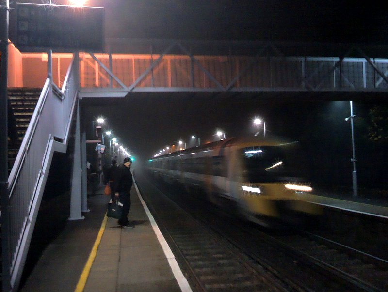 train speeding through Catford Bridge on a misty morning