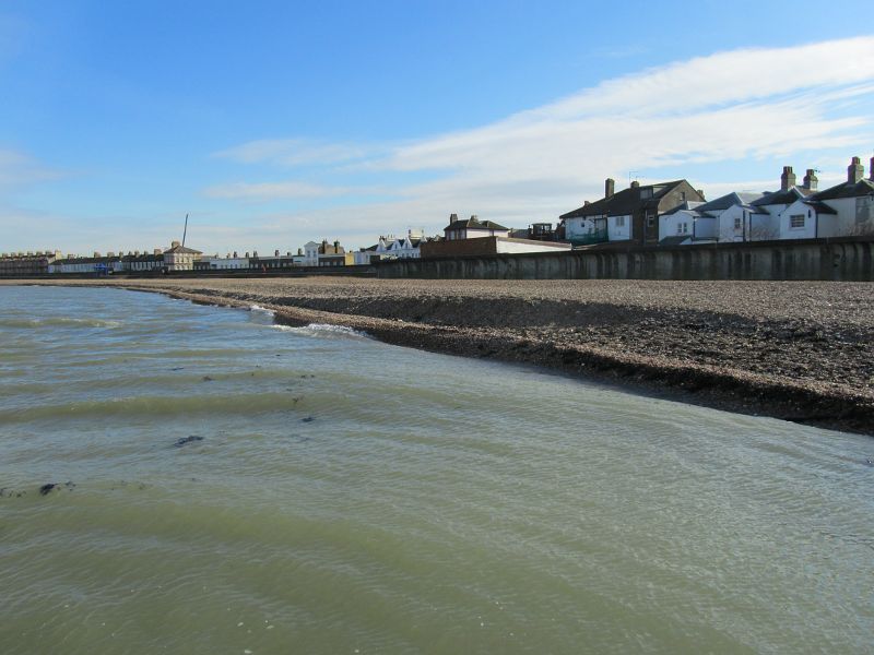 the tide racing along the foreshore