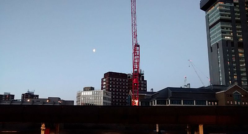 clear blue sky and a bright moon