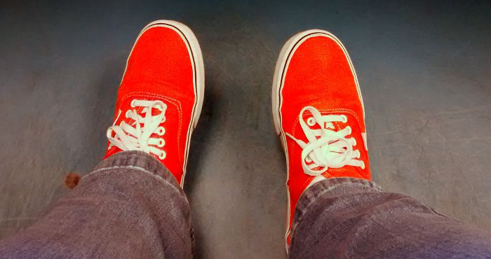 bright orange Vans trainers