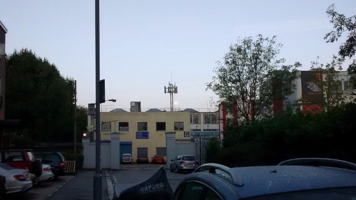 the moon seen as a small
                  white blob next to the tower in the centre of the
                  picture