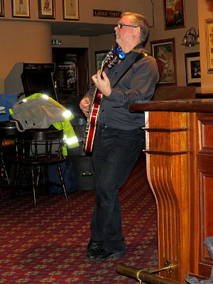 Chris Mayer looking very relaxed while playing guitar