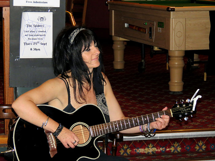 Jo Corteen with electroacoustic guitar