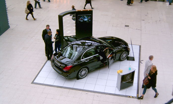 black Mercedes Benz car on Waterloo
                    concourse