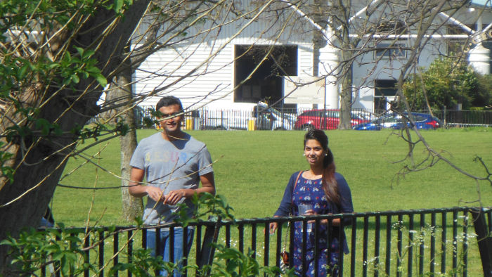 two work colleagues
                          caught walking in the park together