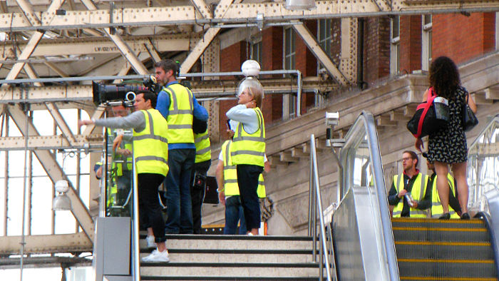 film crew, or pots of people hanging
                          around, earning their pay doing nothing