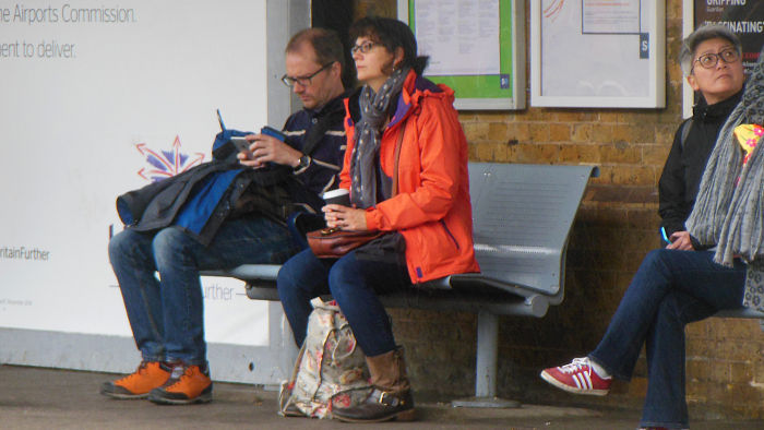 attractive lady in orange
                  jacket