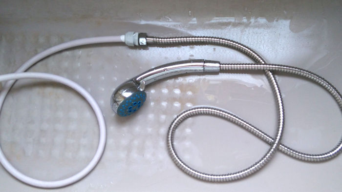 old and new shower
                          hoses connected together with a cable gland