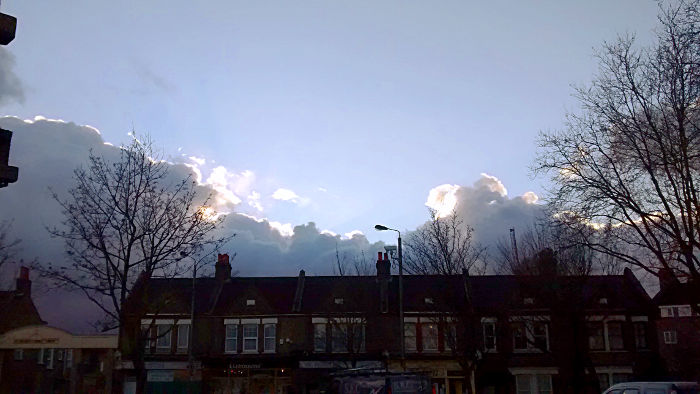 blue sky and black
                          clouds