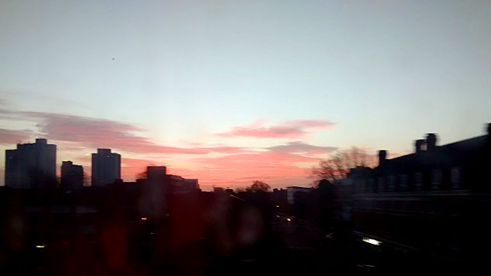 sunrise as seen from inside
                  a moving train