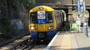 5
                                    car London Overground train pulling
                                    into Denmark Hill station