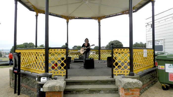 Jo in the middle of a big
                  bandstand