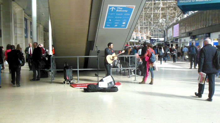 busker on Waterloo
                            station concourse