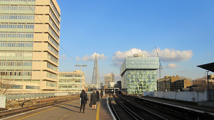 blue sky, fluffy
                              clouds, and The Shard