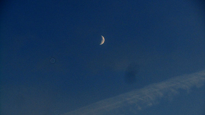The crescent moon viewed
                  from Earlsfield station