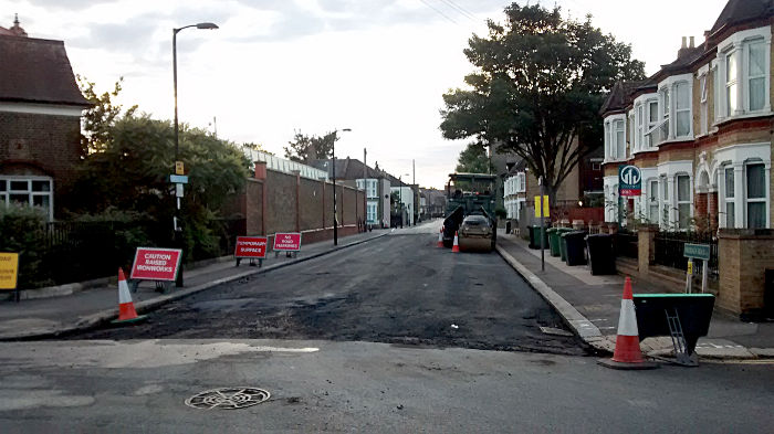 repairing the damage that
                  buses do to what was once a quiet side street