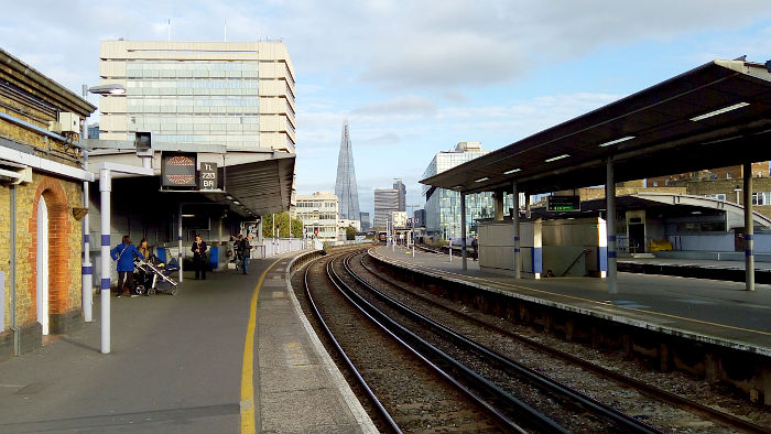 Waterloo East with The Shard
                  in the background