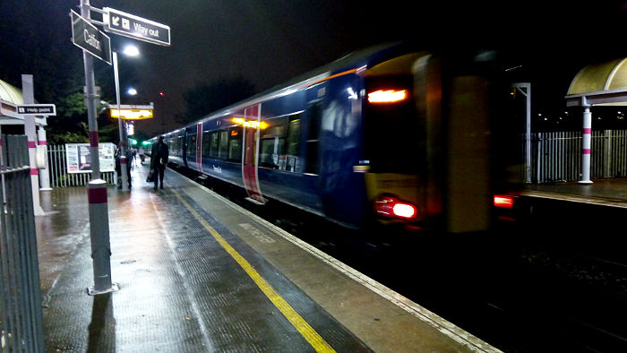 class 387 Thameslink train departing Catford
                  station