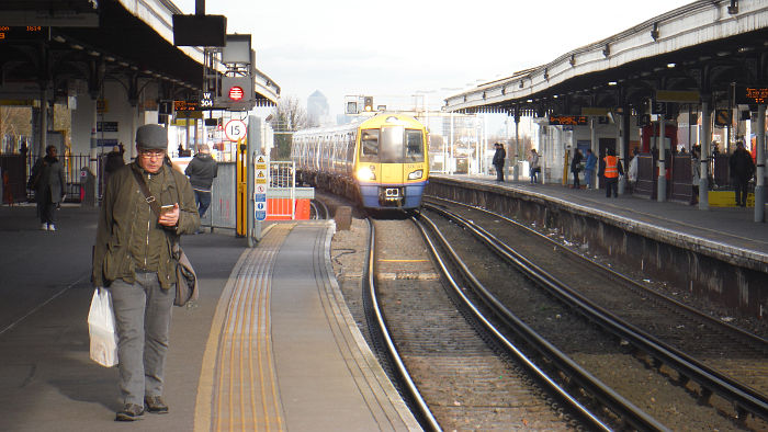 London Overground train
                  arriving at Clapham Junction