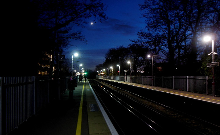 crescent moon over
                            Catford station at 16:40