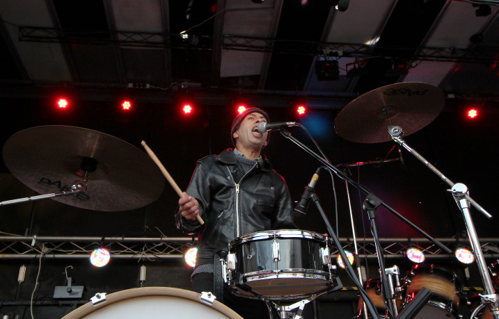 Vince Pross on his
                        stripped down, front of stage, drum kit