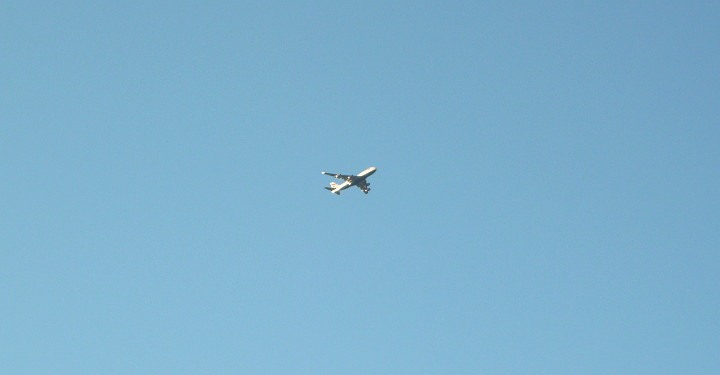 blue sky and a plane