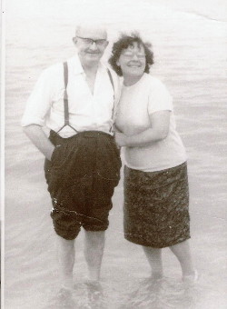 mum and dad paddling in the sea at
                      Leysdown