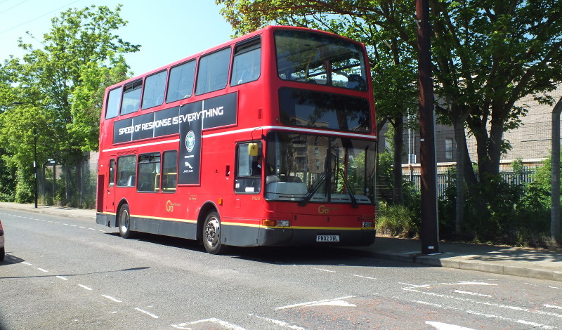 double decker red bus
                        near the park