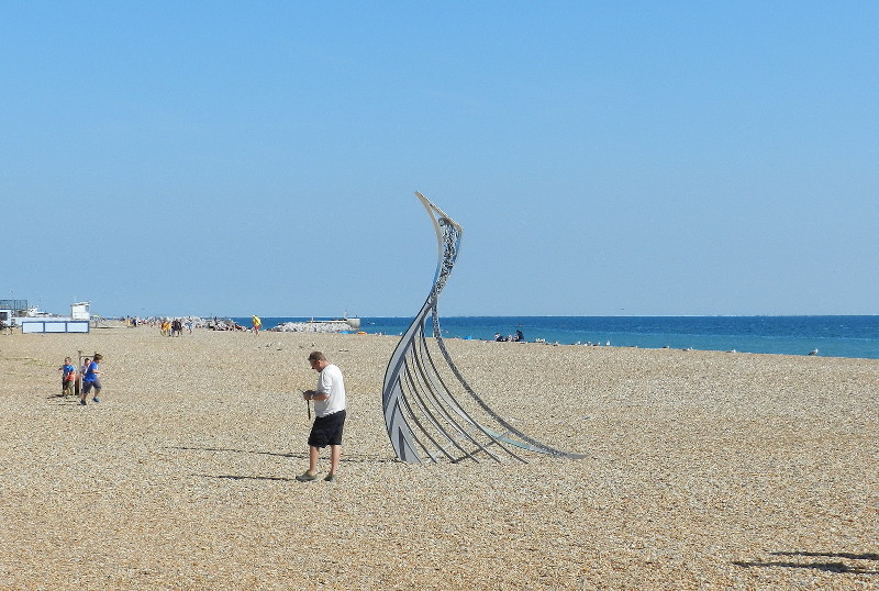 sculpture that depicts the rotting
                          remeins of a viking boat