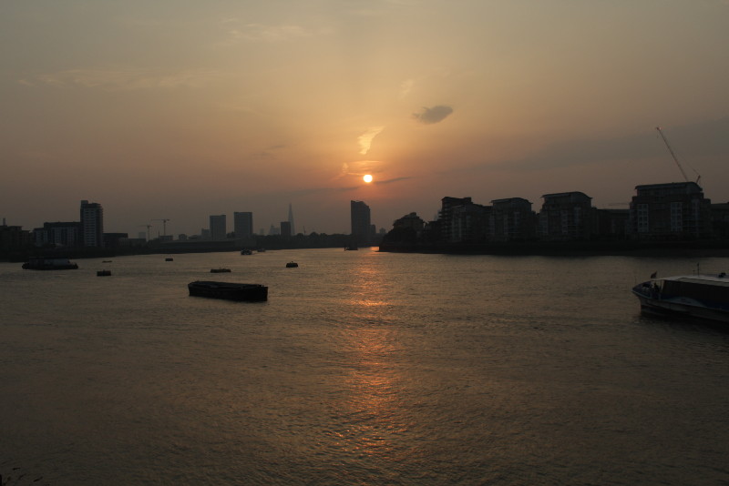 the sun setting over
                        central London