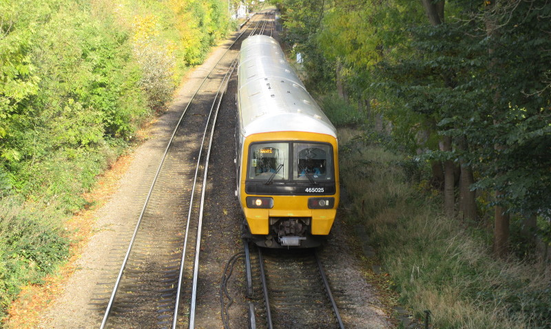 Train about to pass
                        under the footbridge