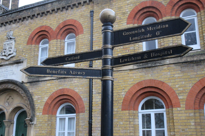 Old sign outside the
                        almshouses