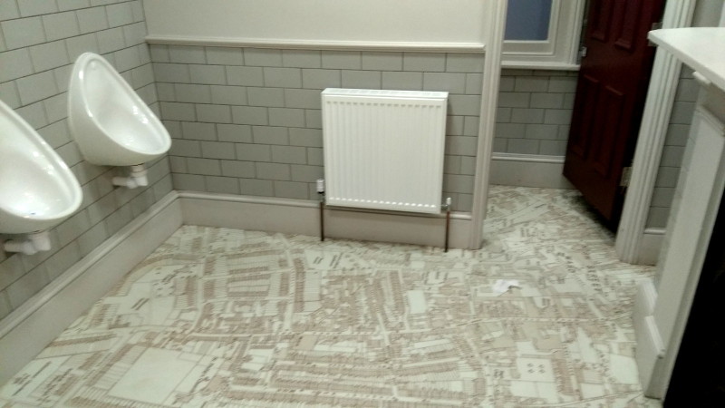 pristine toilets with a
                      map on the floor