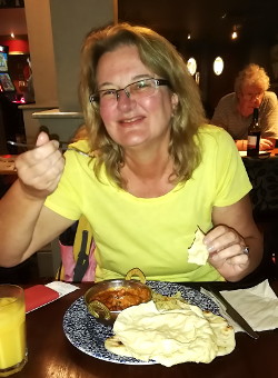 Patricia eating a Wetherspoons
                    curry