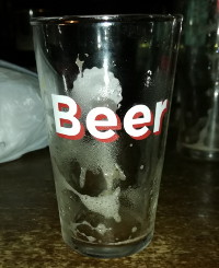 beer glass that says beer !