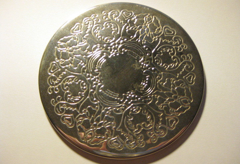 coaster made from a
                          silvery metal