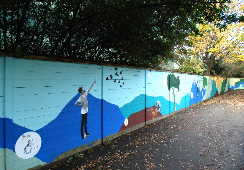 colourful
                                    mural on the wall of an alley