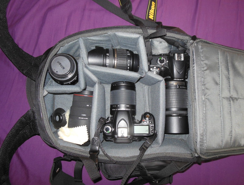 new back pack
                              stuffed with two cameras